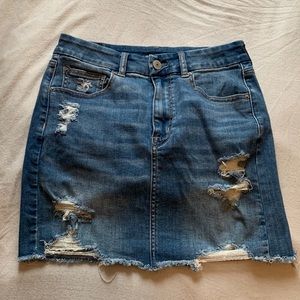 American Eagle Outfitters curvy high-rise denim mini skirt with rips and fringe